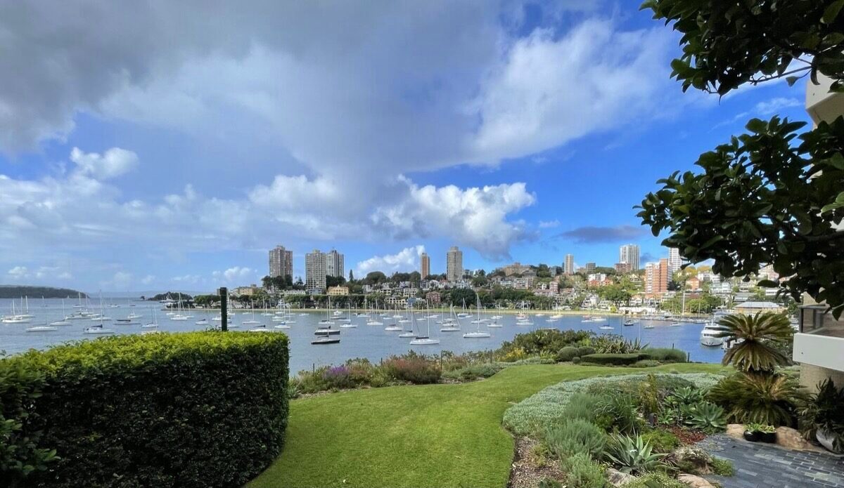 Harbourside estate garden with manicured lawns and Sydney harbour views by RB Kanangra